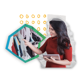 woman employee checking clothes inventory on rack