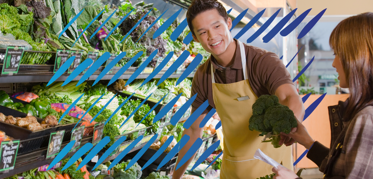 fresh food store worker helping customer